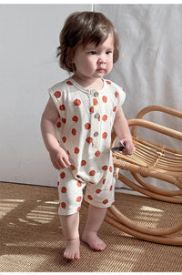 Cream and orange floral baby romper for toddlers with sleeveless design and button front