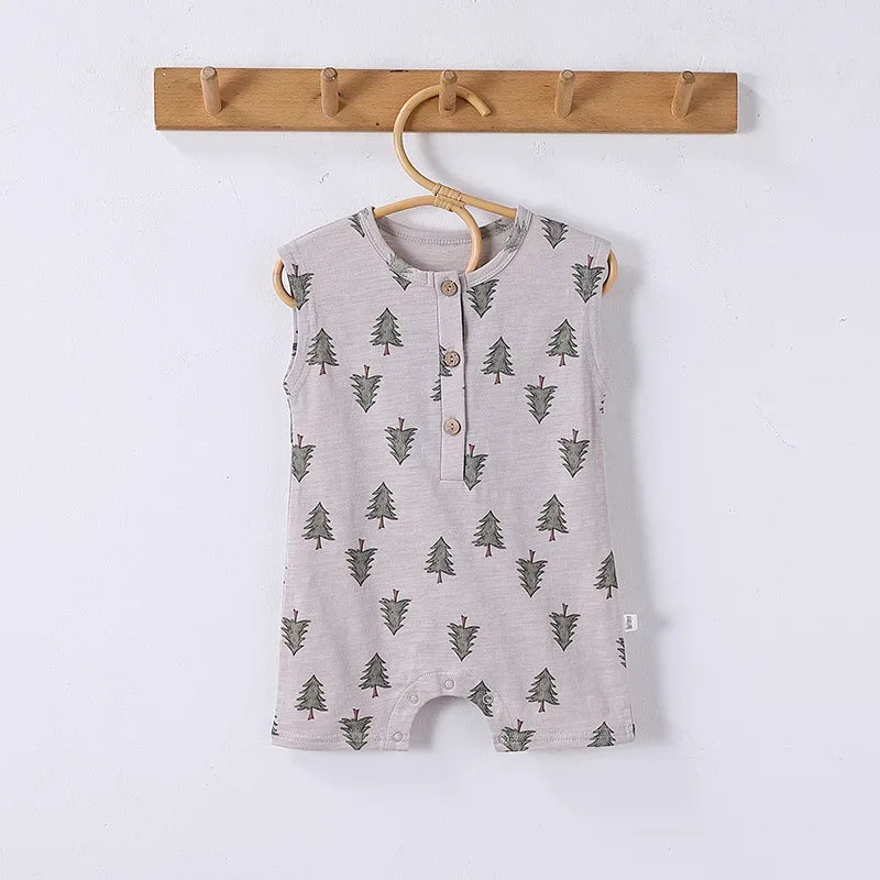 Sleeveless light gray baby romper with green tree floral pattern and wooden buttons
