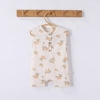 Cream sleeveless floral baby romper for infants with button-front and peach print design