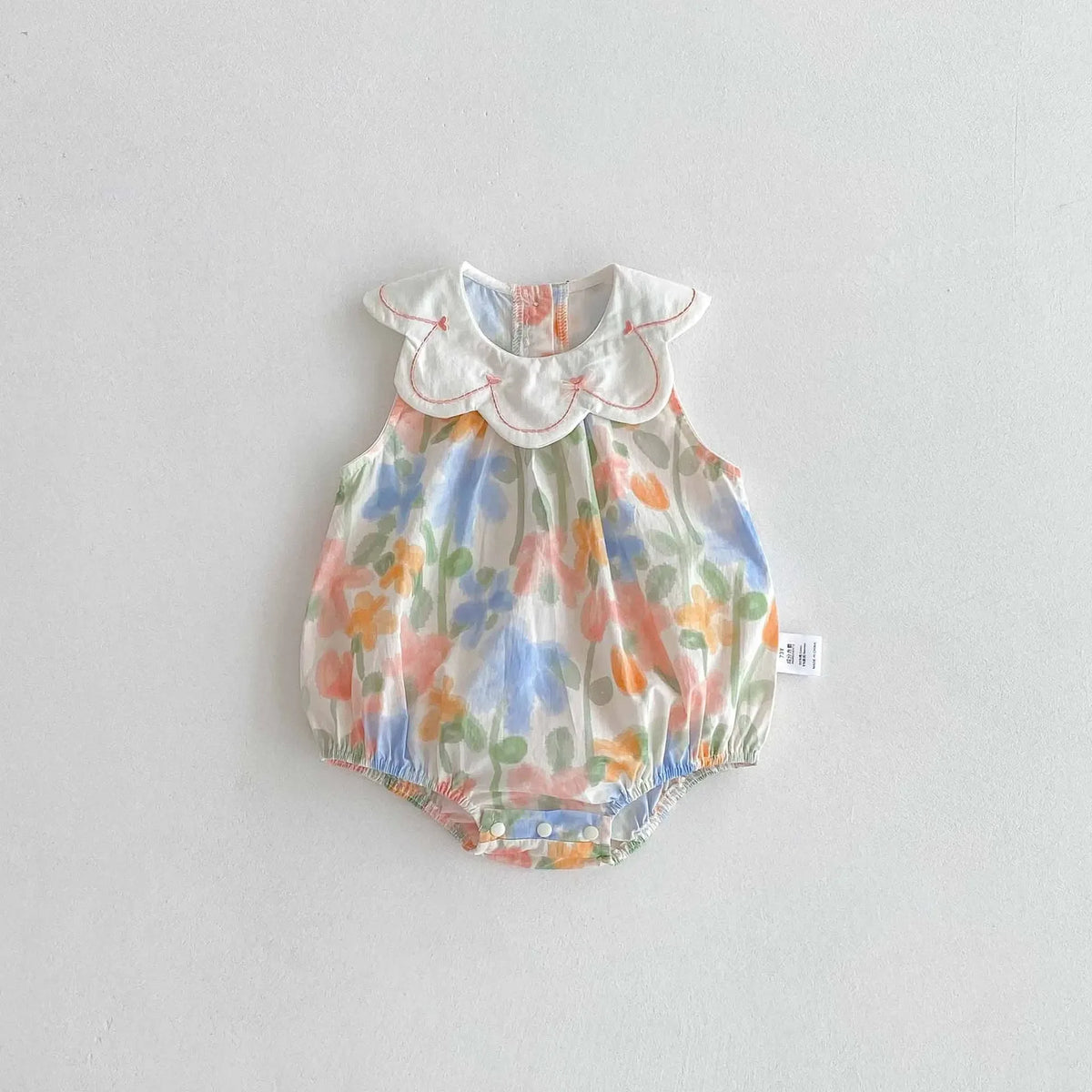 floral baby romper with embroidered collar in pastel colors for infants with sleeveless design