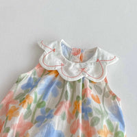 pastel floral baby romper with embroidered collar for infants with scalloped edge detail