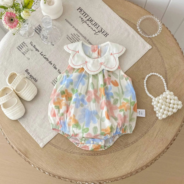 Floral baby romper with embroidered collar in pastel colors for infants with scalloped collar detail