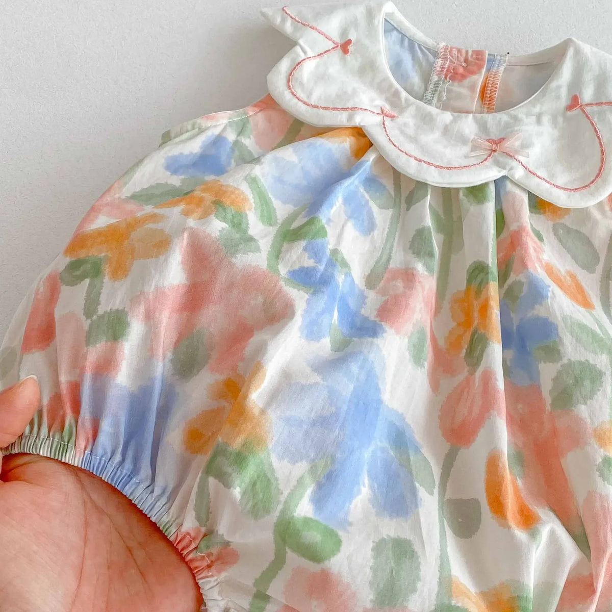 floral baby romper with embroidered collar in pastel colors for infants, short sleeve