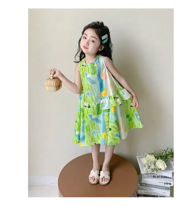 toddler girl wearing green floral print baby dress sleeveless with ruffle detail holding wicker basket