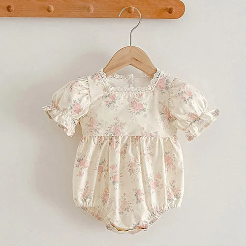 baby girls cream floral print romper with puff sleeves and lace trim size newborn to 12 months