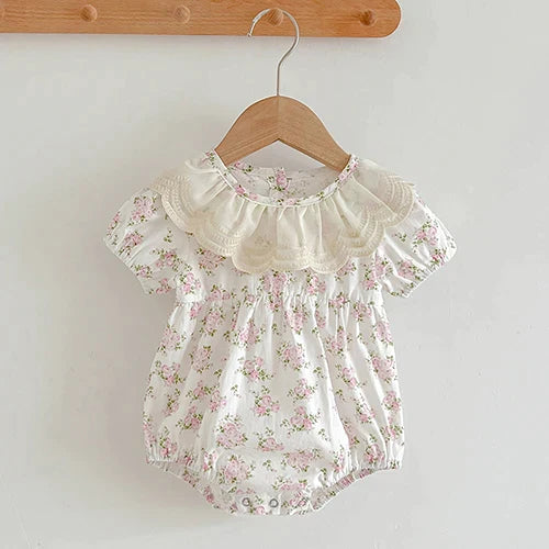 baby floral print romper in white with pink flowers and ruffled collar for infants