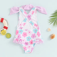 toddler floral print swimsuits for toddlers in pink blue and white with striped bow straps and ruffle details