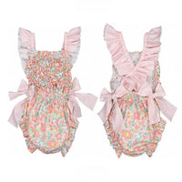 baby girls floral romper with pink striped ruffle straps and bow details romper