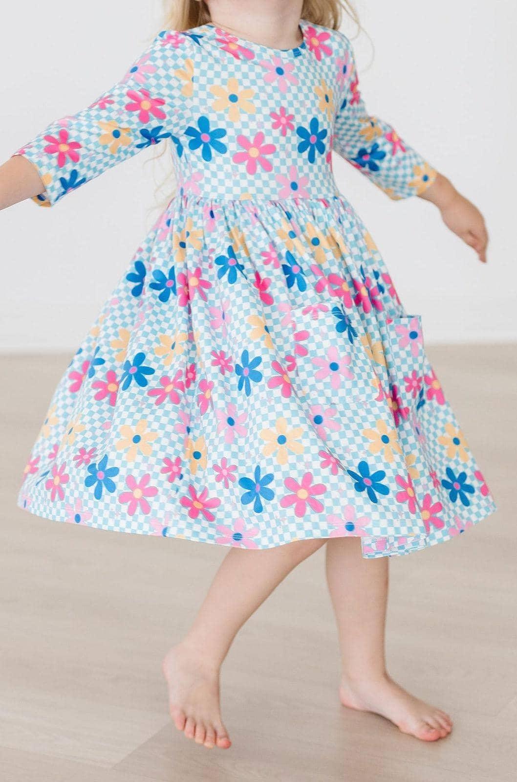 toddler girls blue twirl dress with pink and yellow floral print and 3/4 sleeves