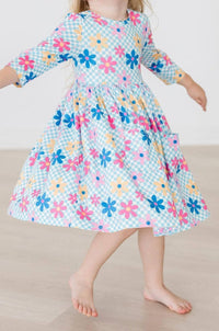 toddler girls blue twirl dress with pink and yellow floral print and 3/4 sleeves