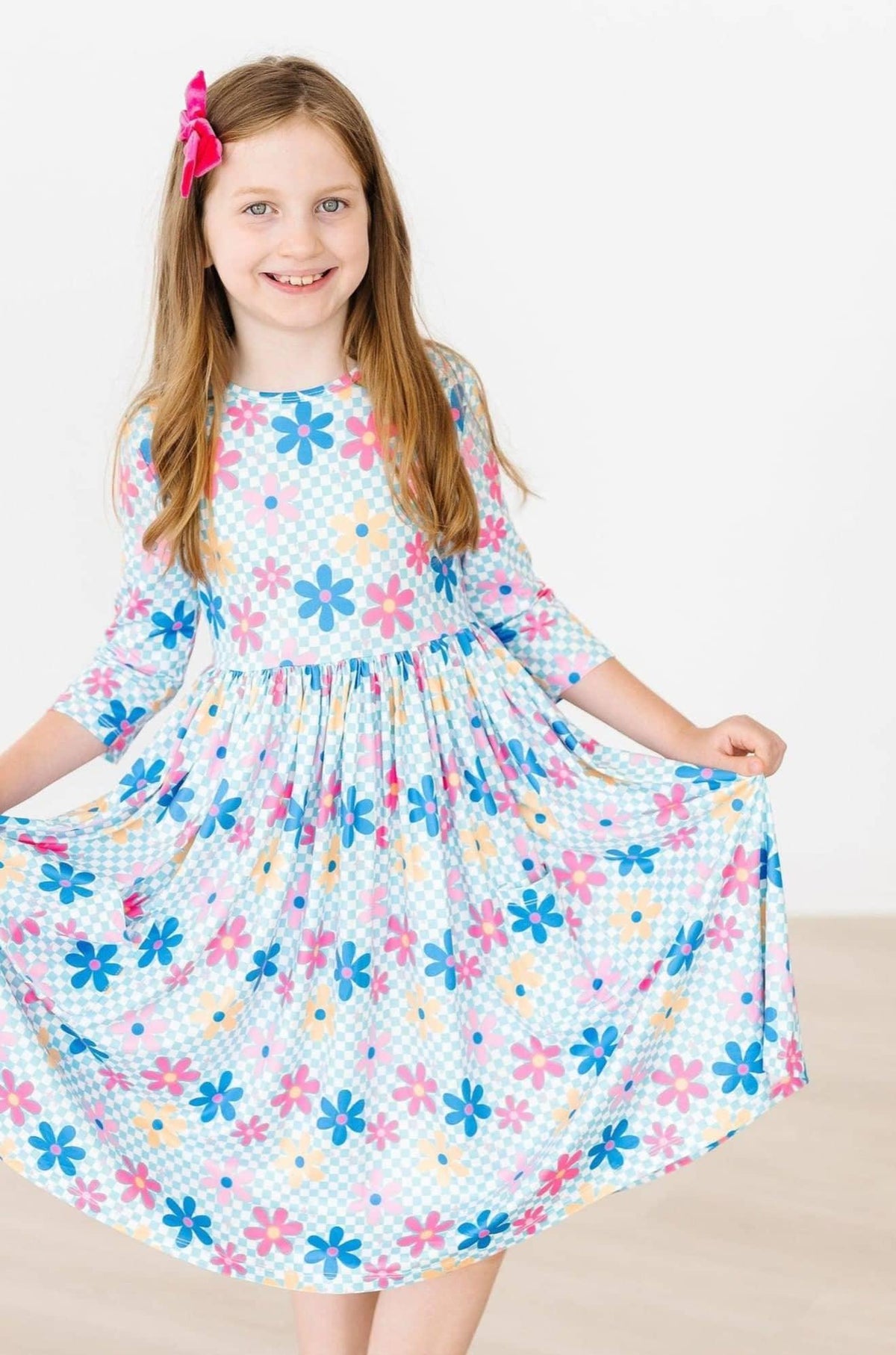 Girls blue and pink floral twirl dress with 3/4 sleeves and pockets by Mila Rose