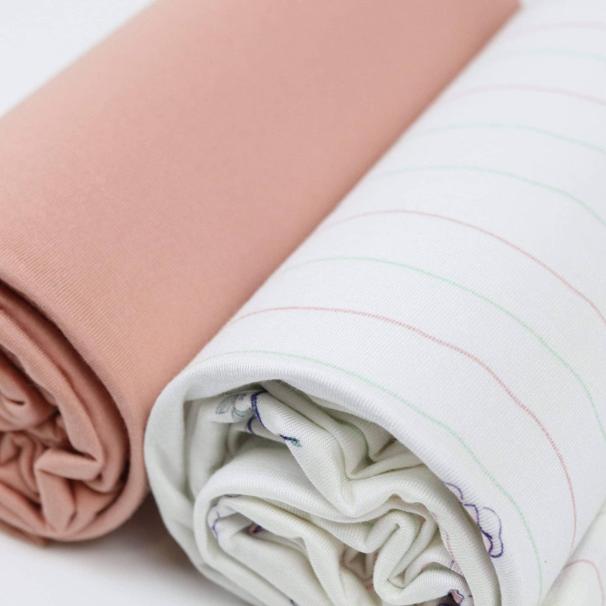 Rolled flower pink baby swaddle blankets for newborns showing soft fabric textures