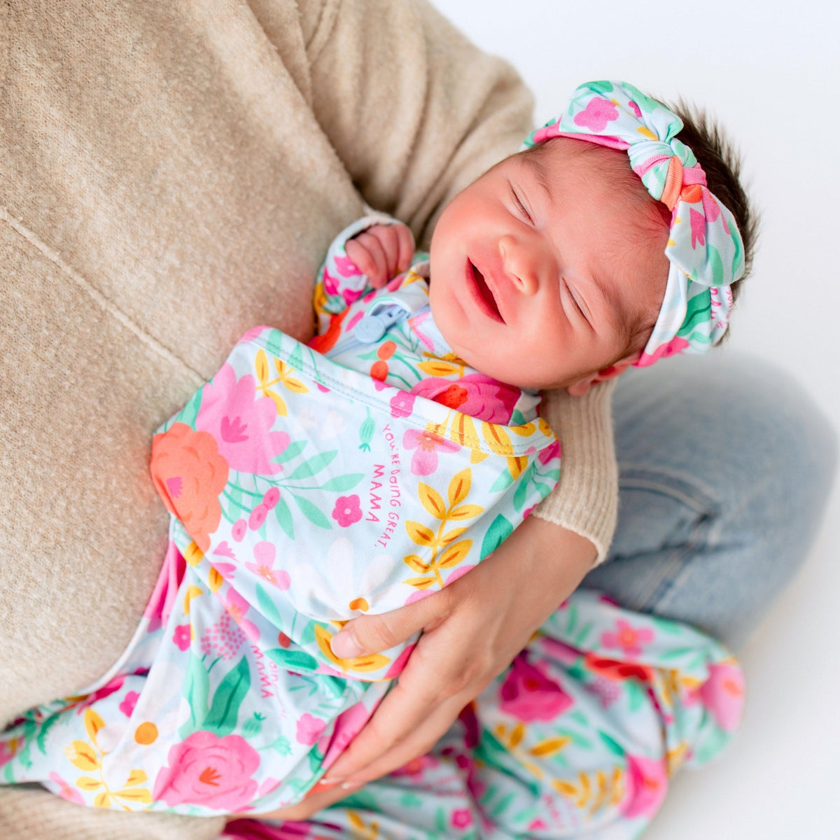 Baby Swaddle Wrap – Flower Power Soft Bamboo Blend displayed with other Raising Mama products, perfect for stylish baby gifts.