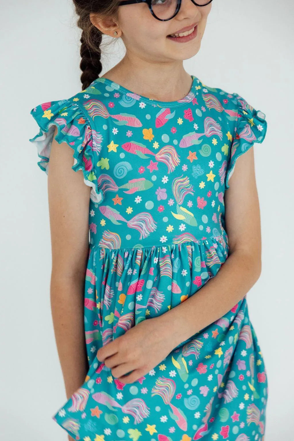 Girls turquoise flutter sleeve twirl dress for girls with colorful sea creature print by Mila & Rose