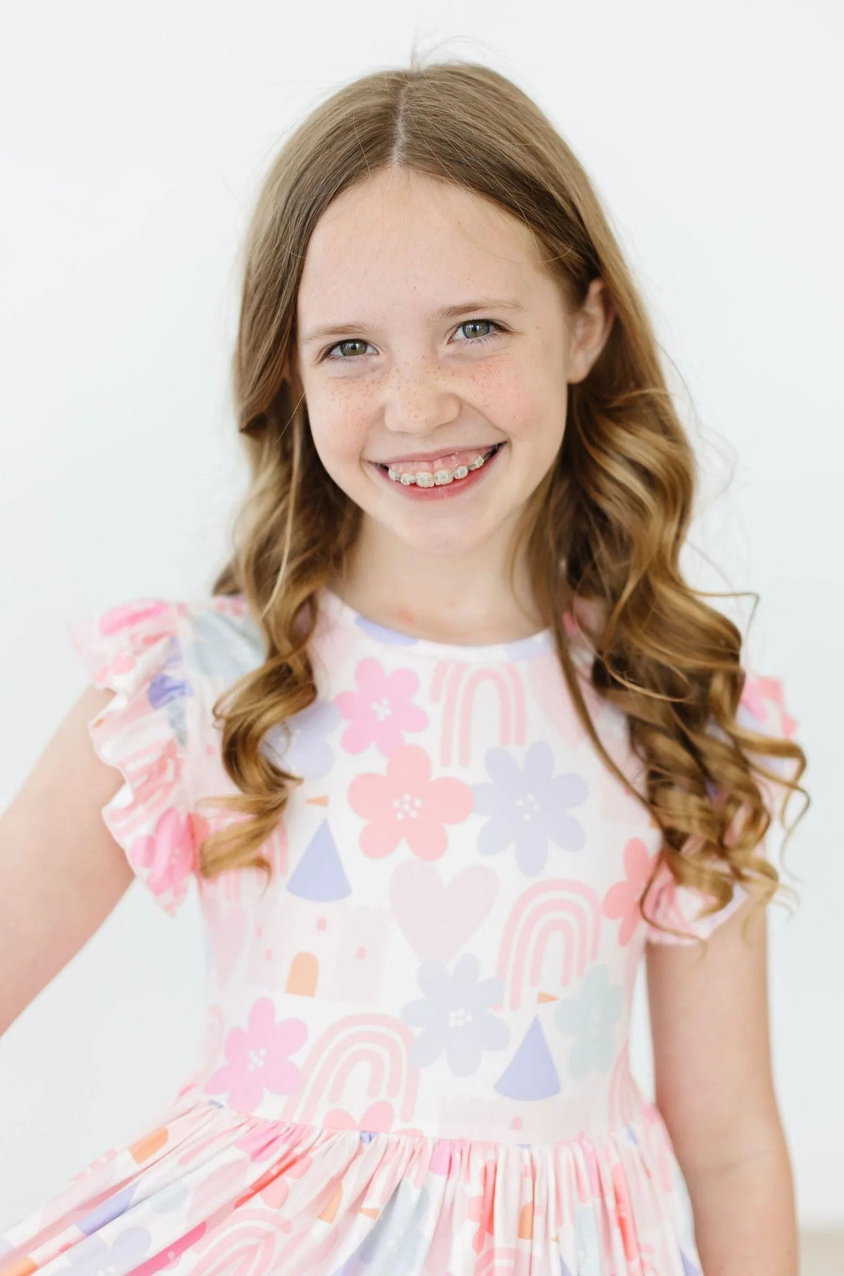 Girls pastel pink flutter sleeve twirl dress for girls with floral and rainbow print, toddler size