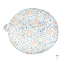 Goosewaddle round floor cushion for children with orange green floral print on white cotton fabric