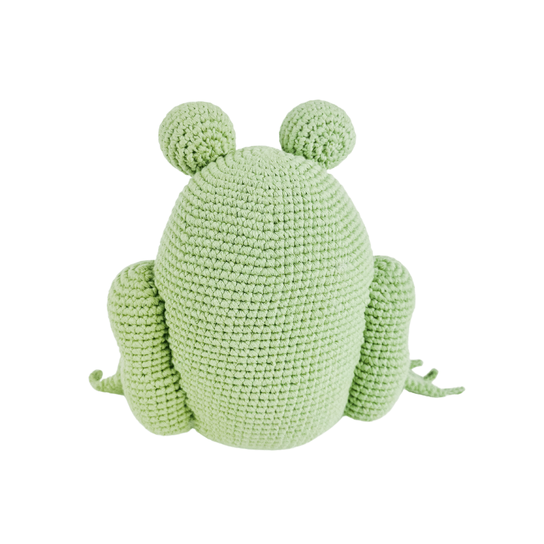 Back view of a light green amigurumi frog. Hand-crocheted from organic cotton with round eyes and small limbs, perfect for pretend play.