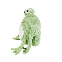 Hand-crocheted bright green frog toy with big eyes and white belly. Soft organic cotton stuffed animal for pretend play.