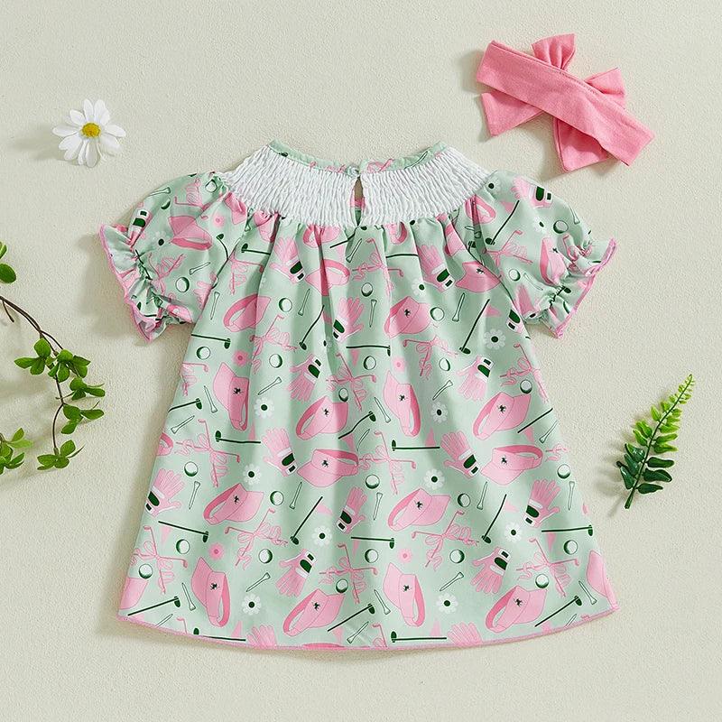 toddler girls green and pink golf dress with smocked white neckline and ruffle sleeves