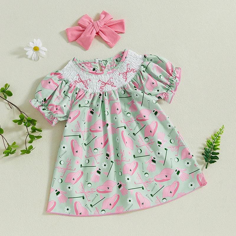 toddler girls golf dress in pastel green and pink with smocked collar and puff sleeves