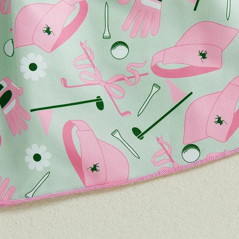 girls pastel green and pink golf dress fabric with golf-themed print including hats gloves and balls
