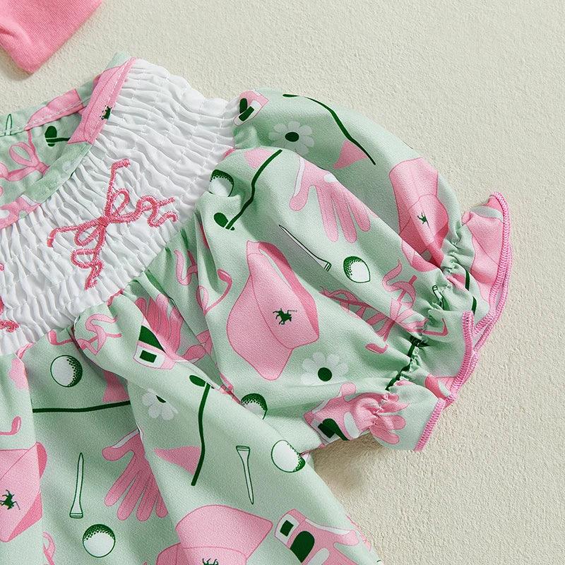 baby girl golf dress with pink and green golf print and smocked white bodice