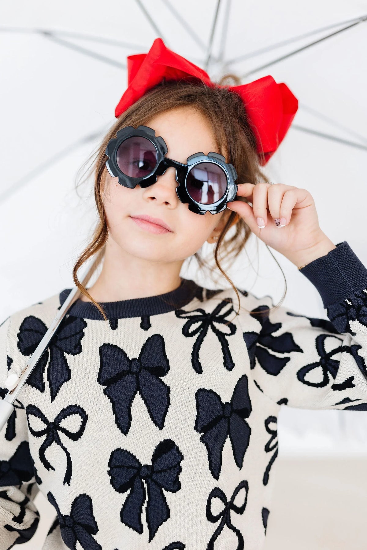 Girls cream and black knit sweater with bow patterns by Mila & Rose, long sleeve