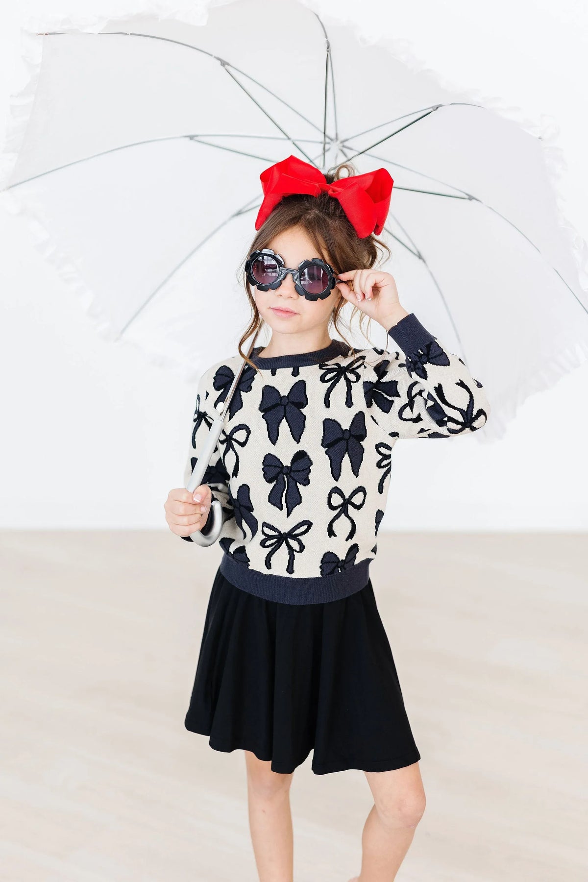 Girls black and white knit sweater with bow pattern long sleeve from Mila & Rose