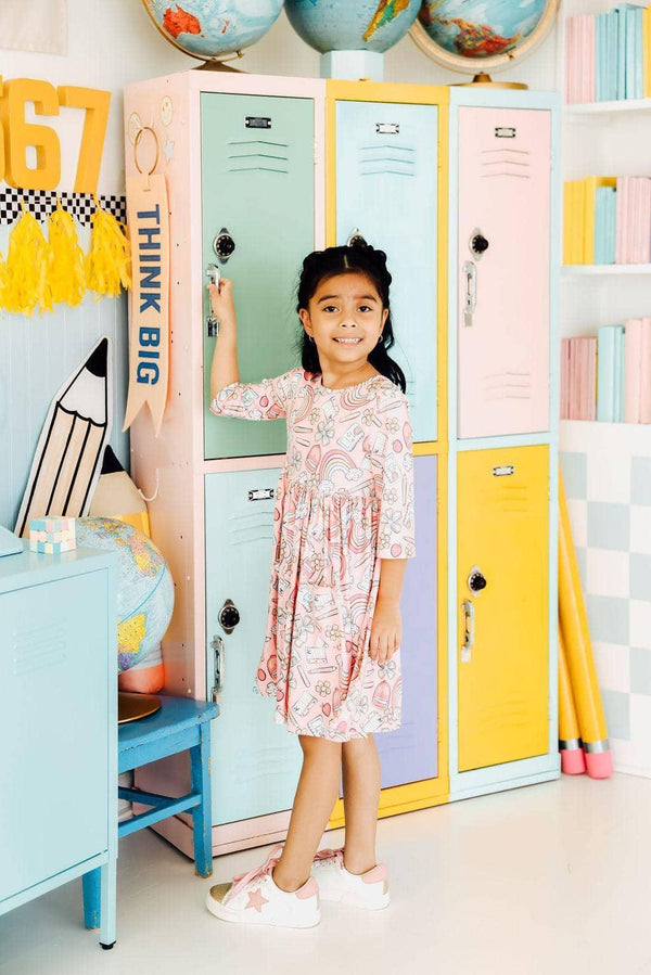 Girls 3/4 sleeve twirl dress in pastel pink with swirl pattern for young girls