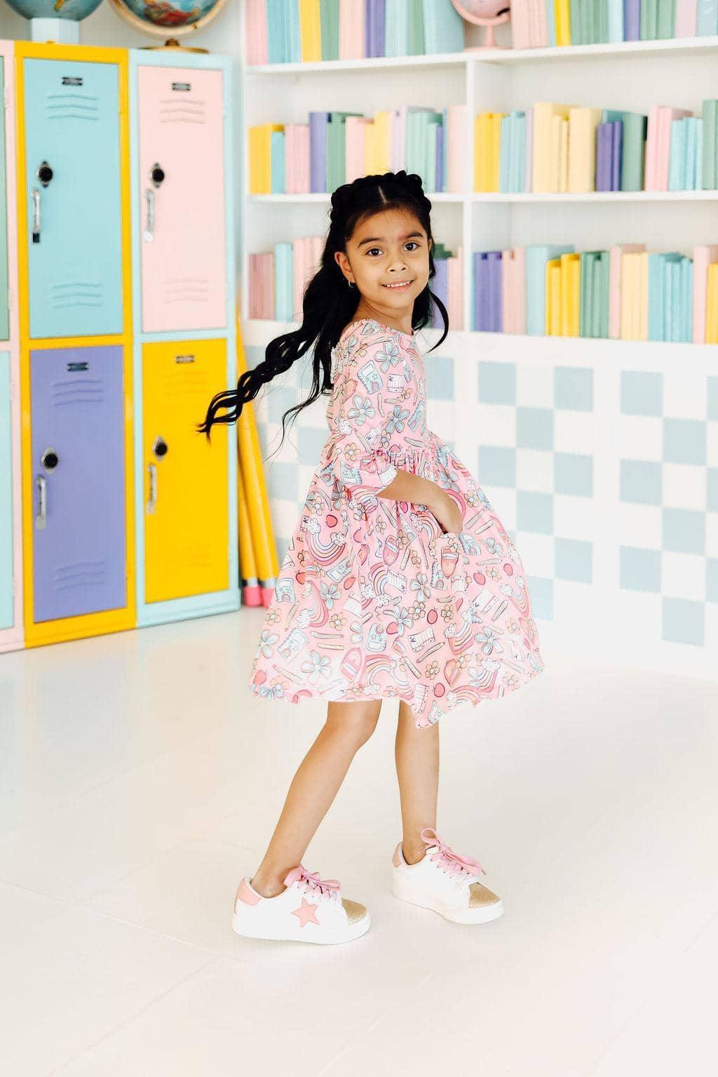 Girls 3/4 sleeve twirl dress in pink with colorful patterns, size for young girls, playful and comfortable design
