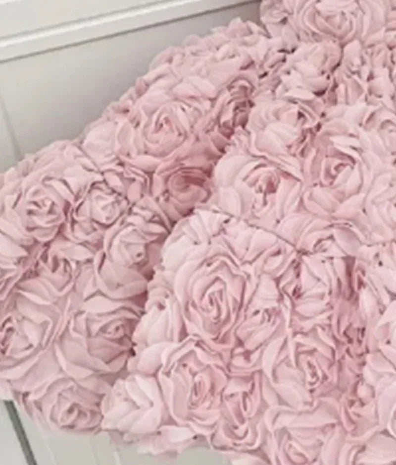 Girls pink 3D floral formal dress with textured rose details, suitable for toddlers and young kids