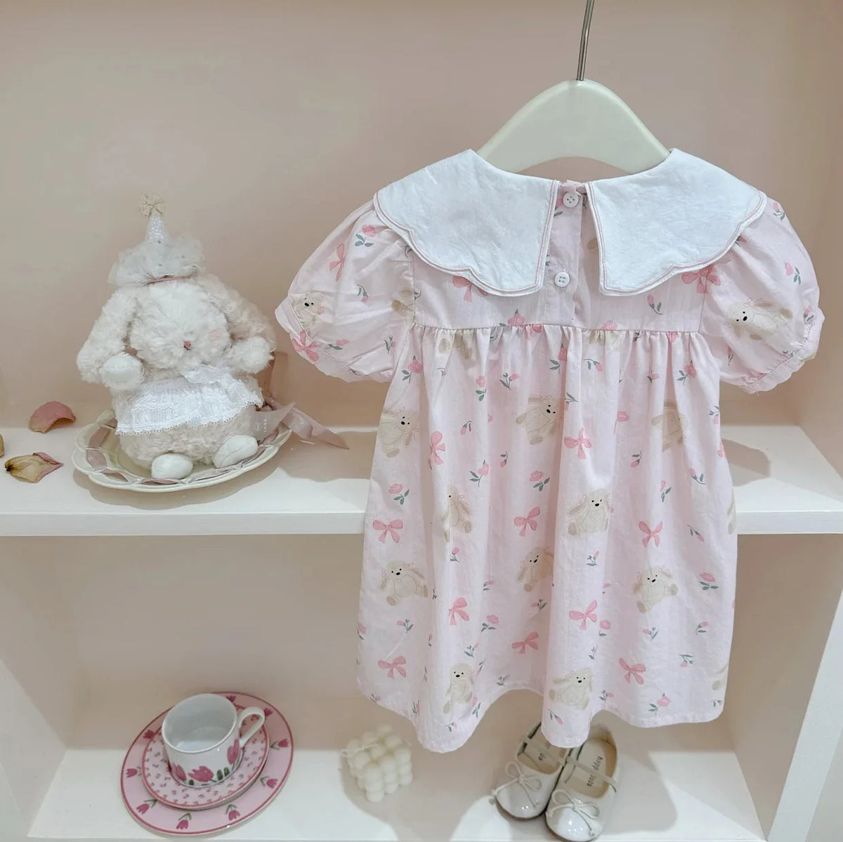 pink girls a-line flower dress with white collar for baby kids hanging on hanger