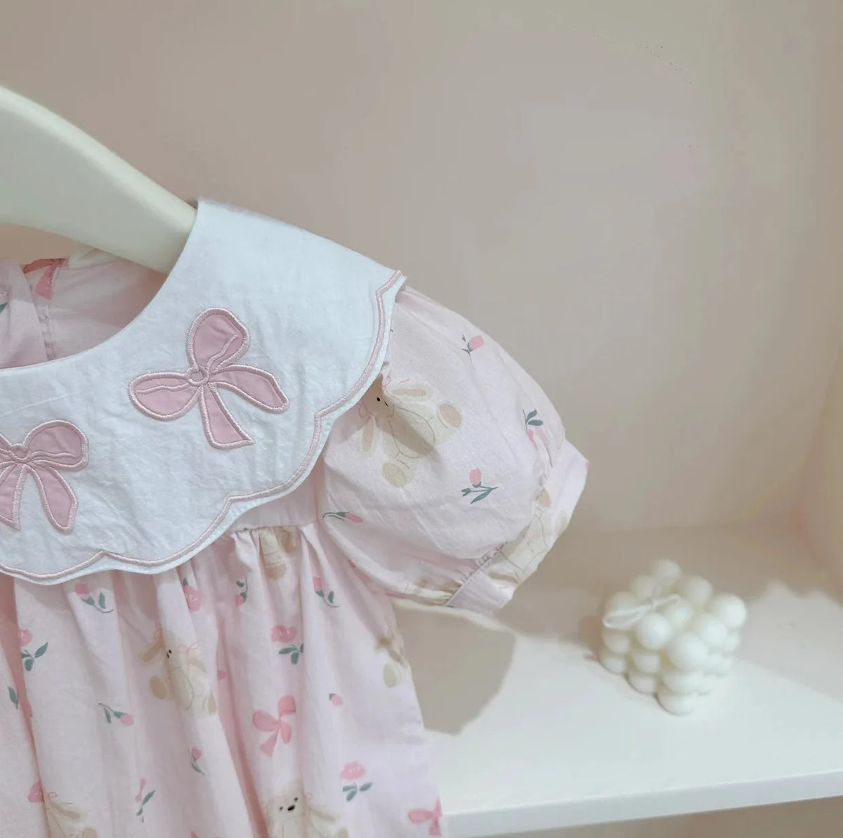 Pink girls a-line flower dress with white collar and bow details for baby toddlers