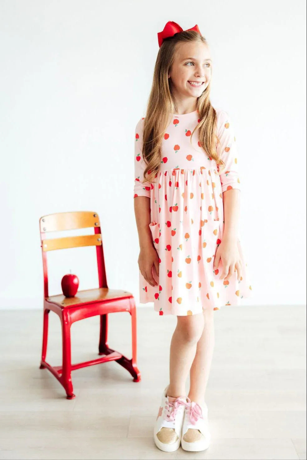 Girls apple print twirl dress by Mila and Rose, sleeve pink dress with apple pattern for young girls