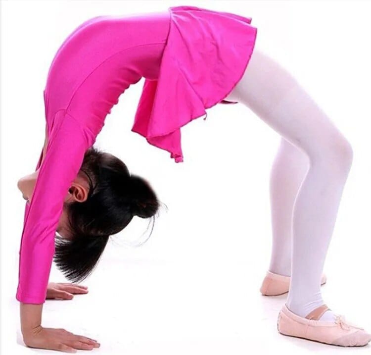 Girls pink ballerina tutu dress with long sleeves worn by child performing backbend
