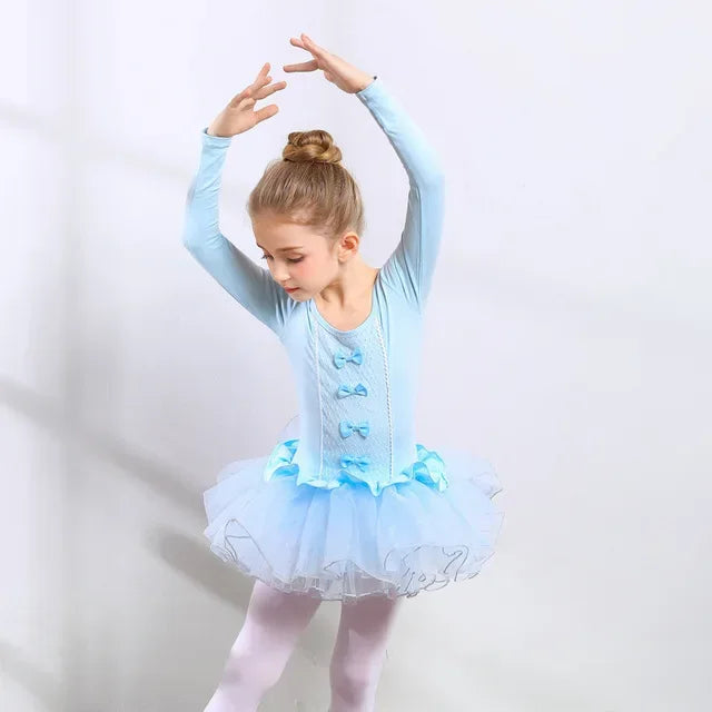 Girls ballet tutu dress in light blue with long sleeves and decorative bows, suitable for young dancers