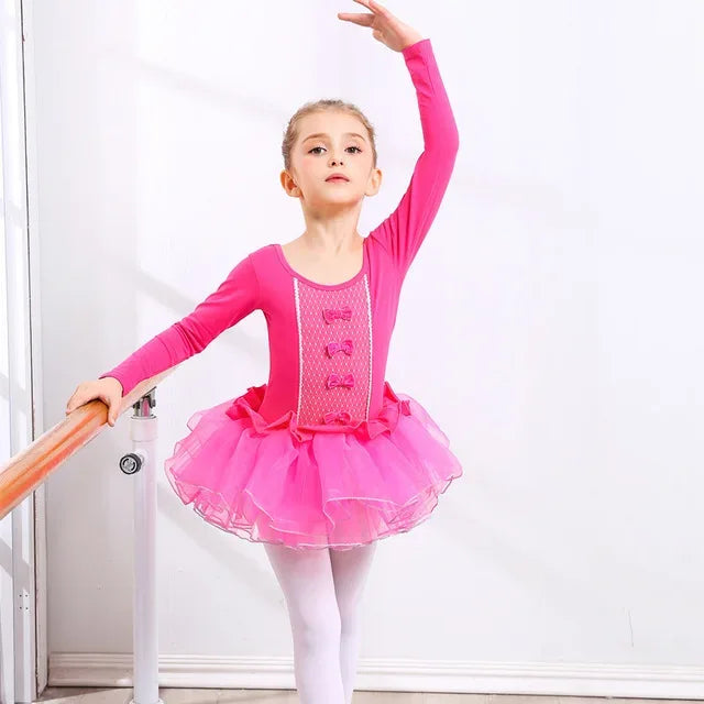 Girls ballet tutu dress in bright pink with long sleeves and bow details, size for young kids