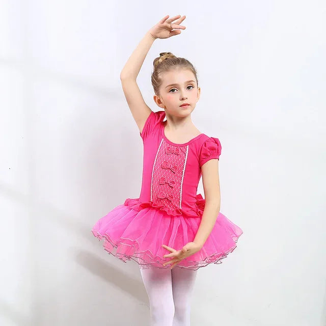 Girls ballet tutu dress in bright pink for ages 4-6 with puff sleeves and bow details