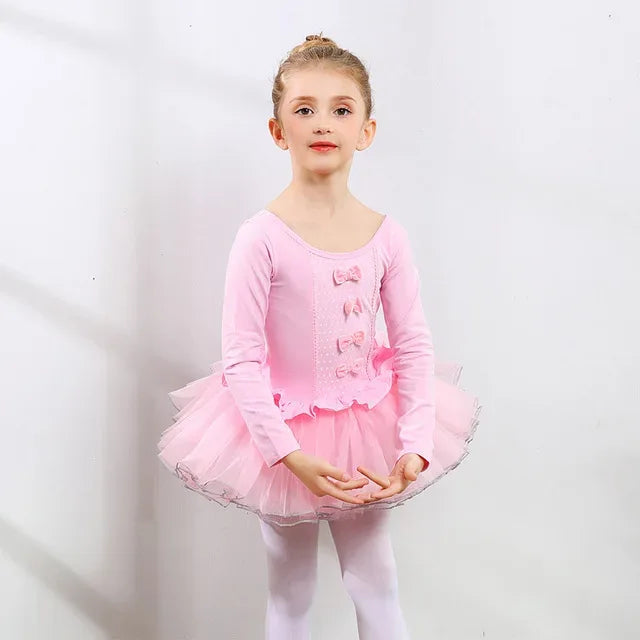 Pink girls ballet tutu dress for ages 3 to 6 with long sleeves and bow details on bodice