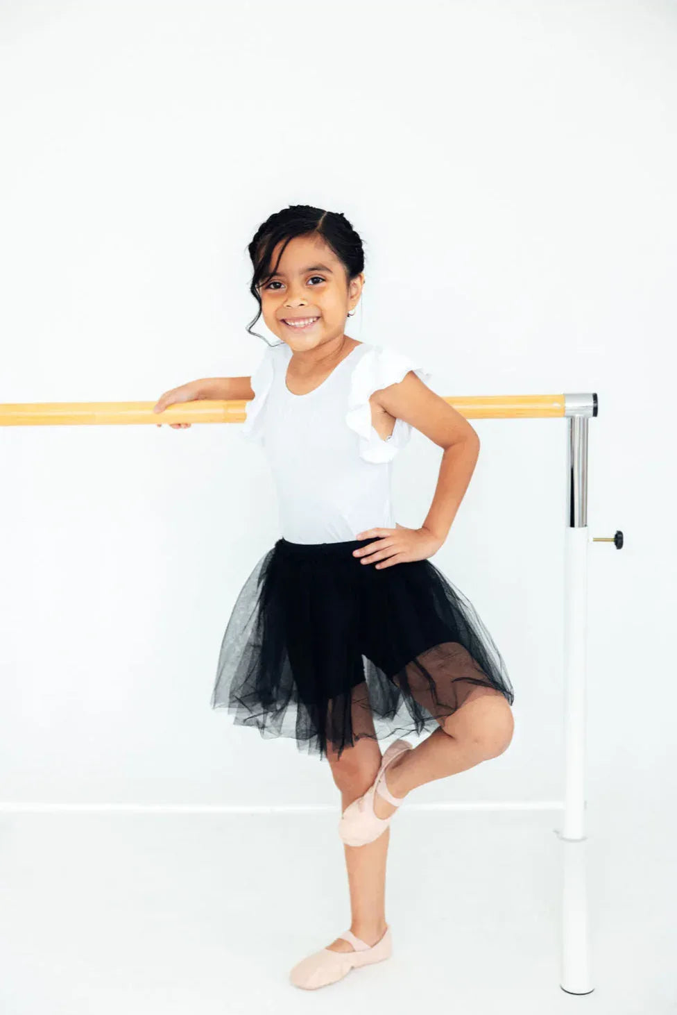 Girls black tutu shorts for young dancers with layered tulle skirt and elastic waistband