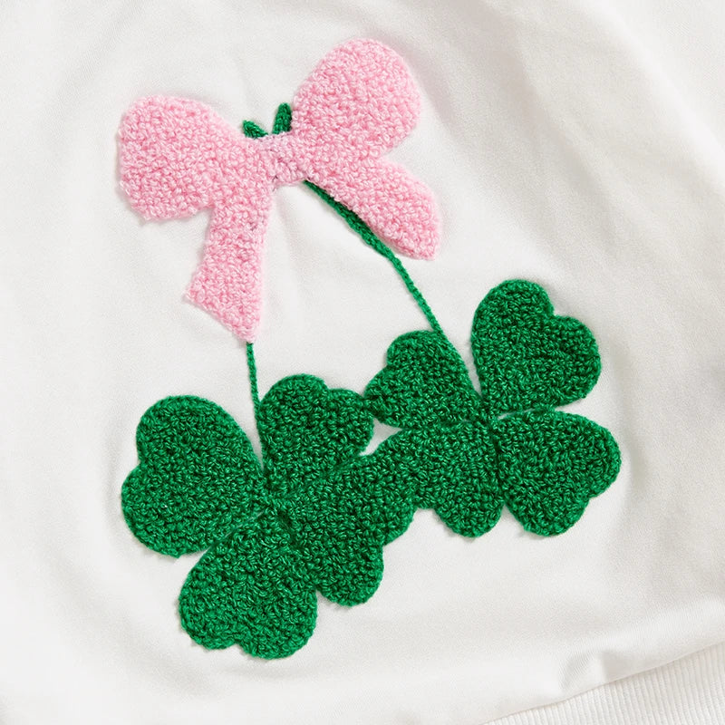 White cotton girls bow clover sweatshirt with textured green clover leaves and a pink bow design