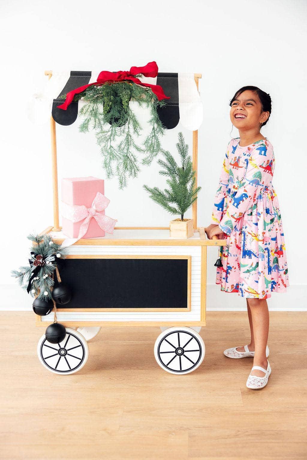 Girls dinosaur long sleeve dress by Mila Rose in colorful print with twirl skirt and pockets, child size