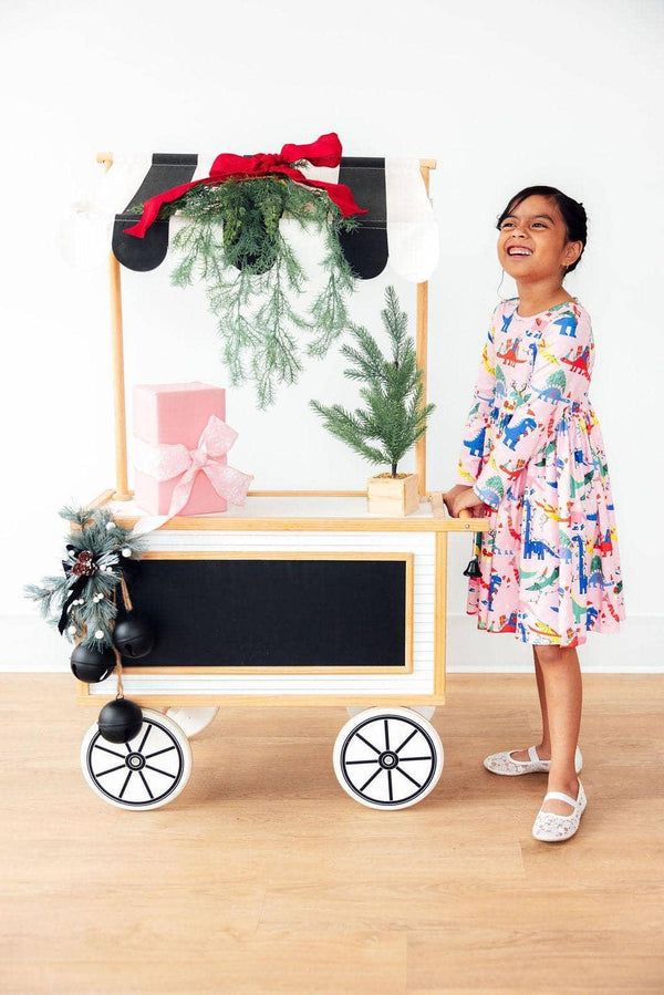Girls dinosaur long sleeve dress by Mila Rose in colorful print with twirl skirt and pockets, child size