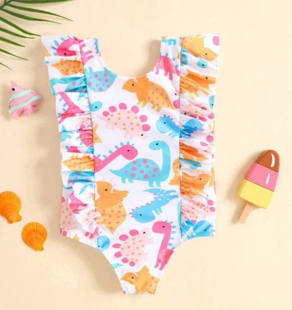Girls dinosaur one piece swimsuit in colorful pastel with ruffle trim for toddlers