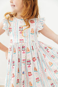 Girls white twirl dress for birthday with colorful cake print and flutter sleeves