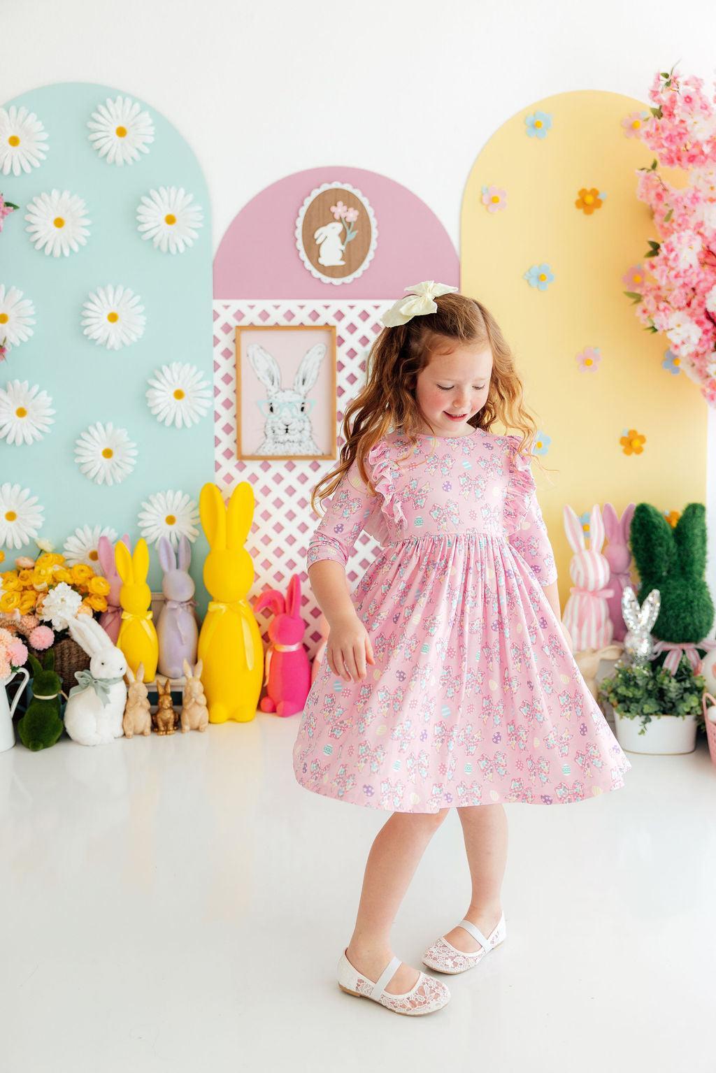 Pink twirl ruffle girls dress for young girls with 3/4 sleeves and floral pattern