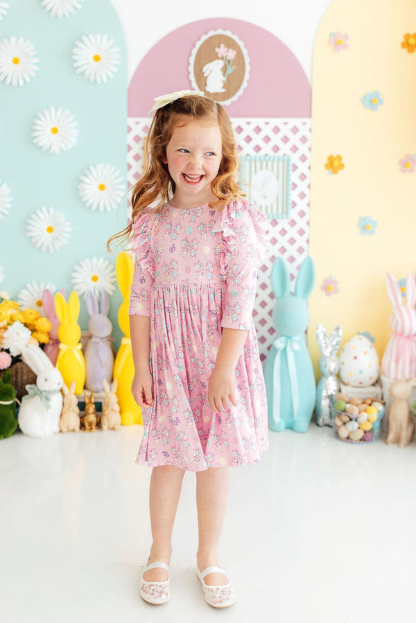 Girls pink twirl ruffle dress with floral print and 3/4 sleeves by Mila & Rose