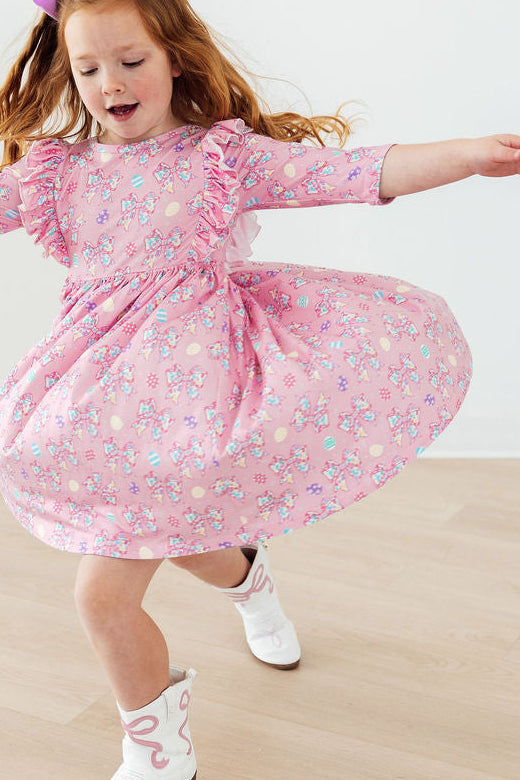 Girls pink twirl ruffle dress with floral print and 3/4 sleeves for toddlers