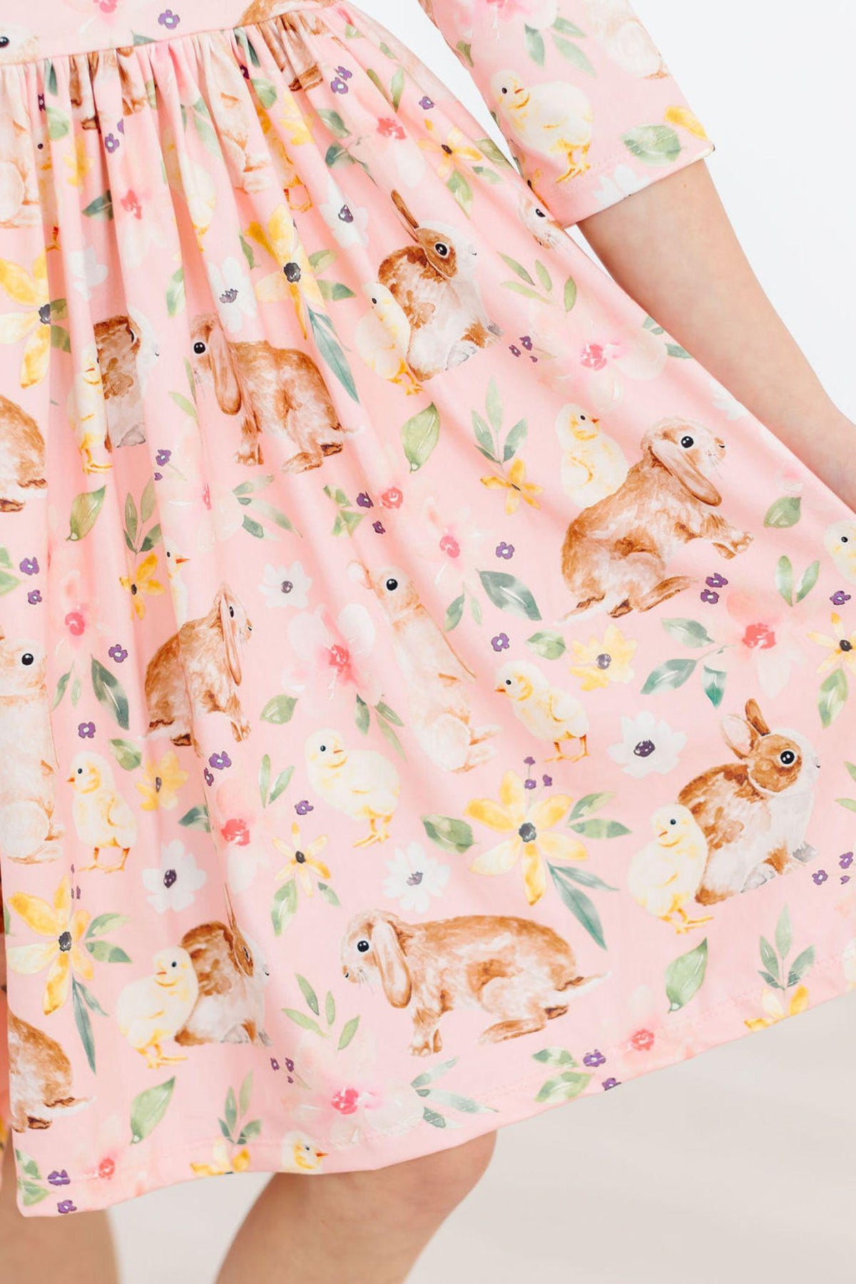 Girls pink twirl ruffle dress with 3/4 sleeves and bunny and chick print by Mila & Rose