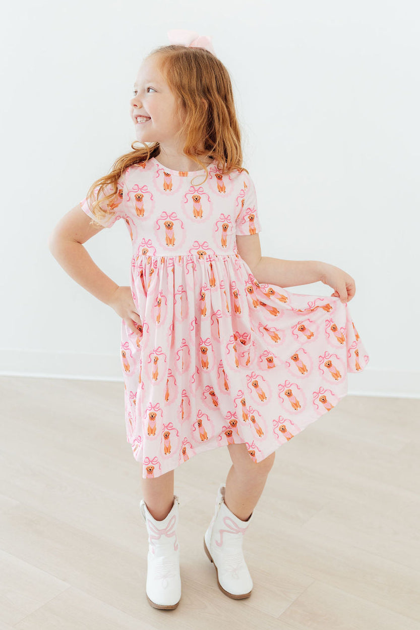 Girls pink twirl pocket dress with short sleeves and orange floral print, toddler size